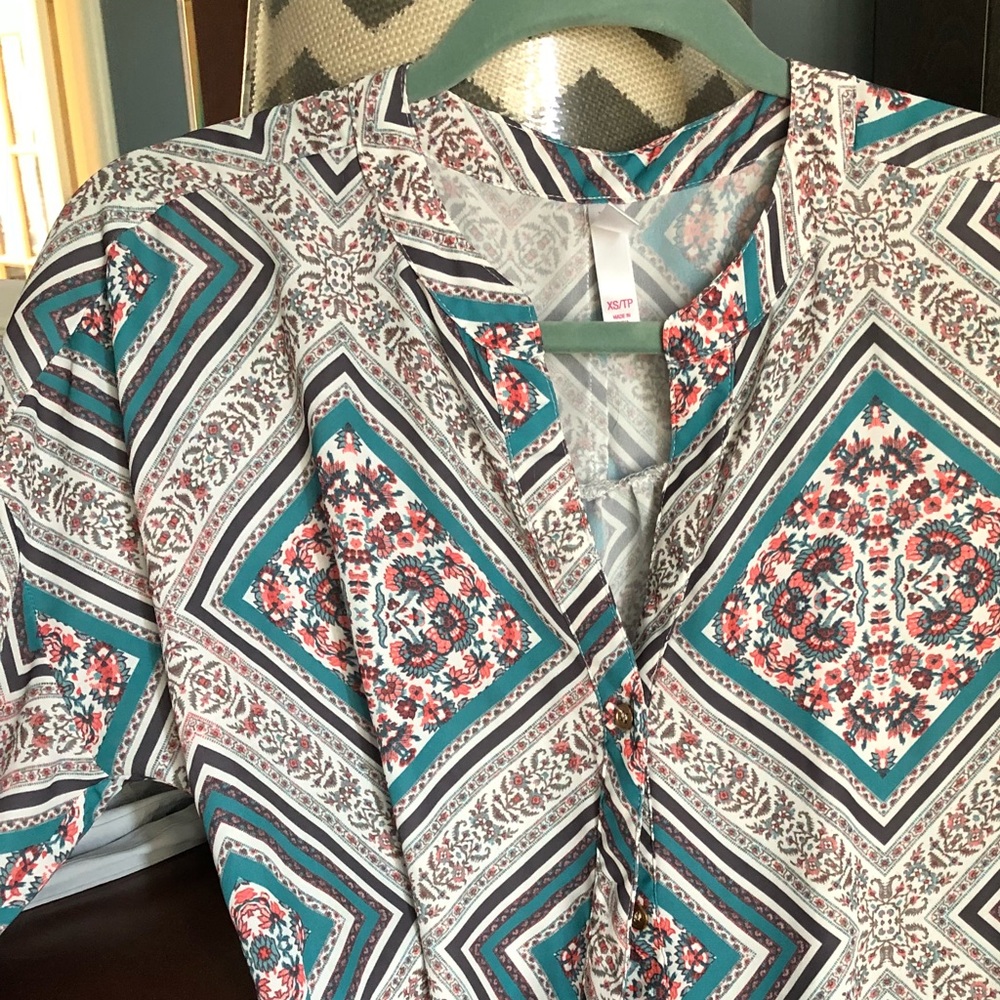 Colorful blouse, button down.